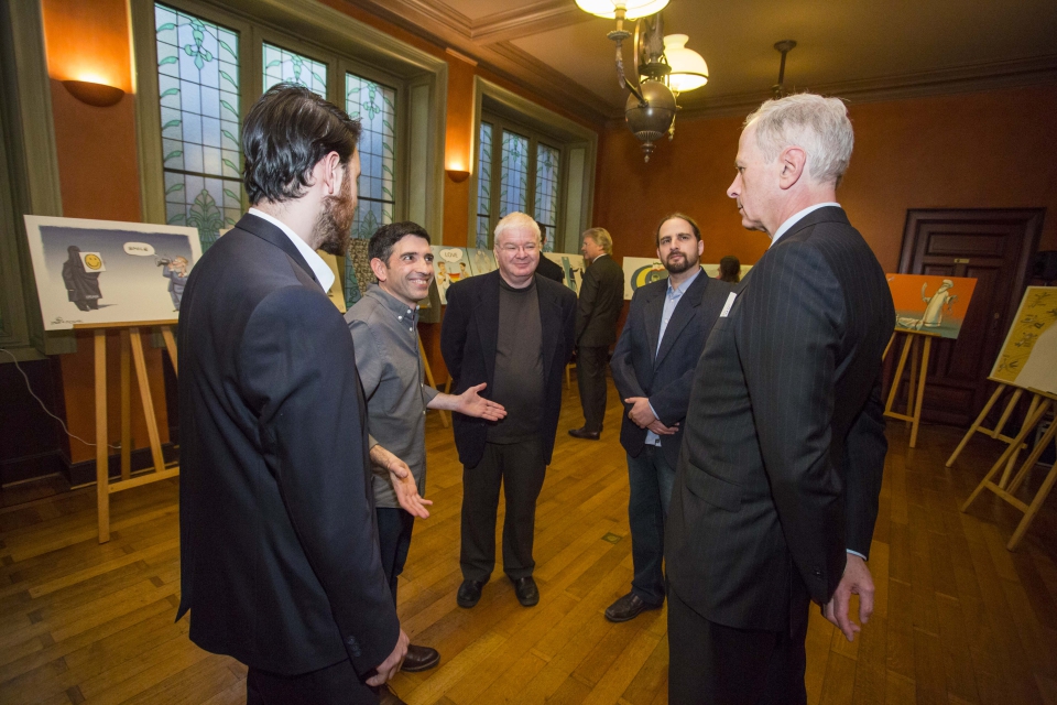 Exhibition guests in discussion with the artists of The Israeli Cartoon Project